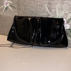 La Regale Beautiful Clutch. Last picture shows some wear in shiny exterior.